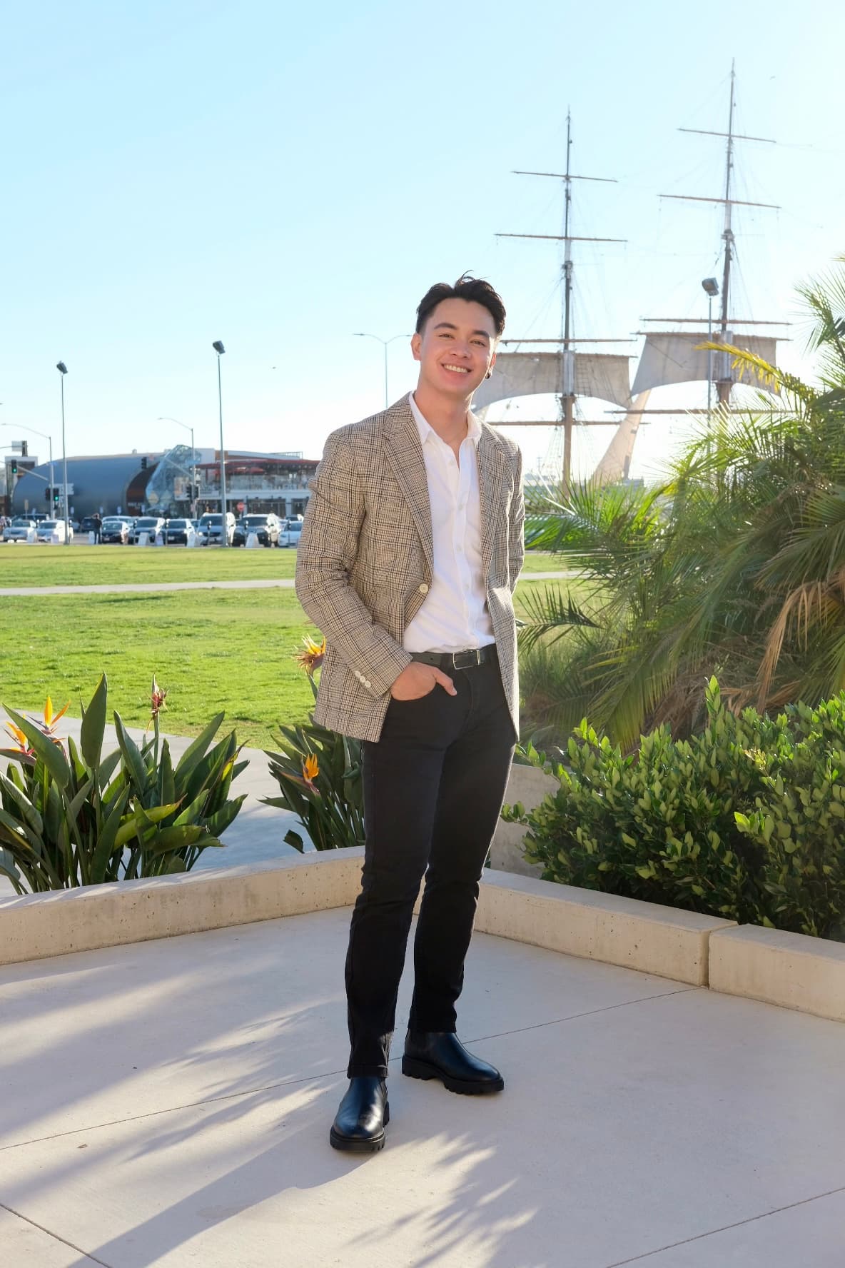 Jeff Perez smiling in a blazer at the San Diego waterfront